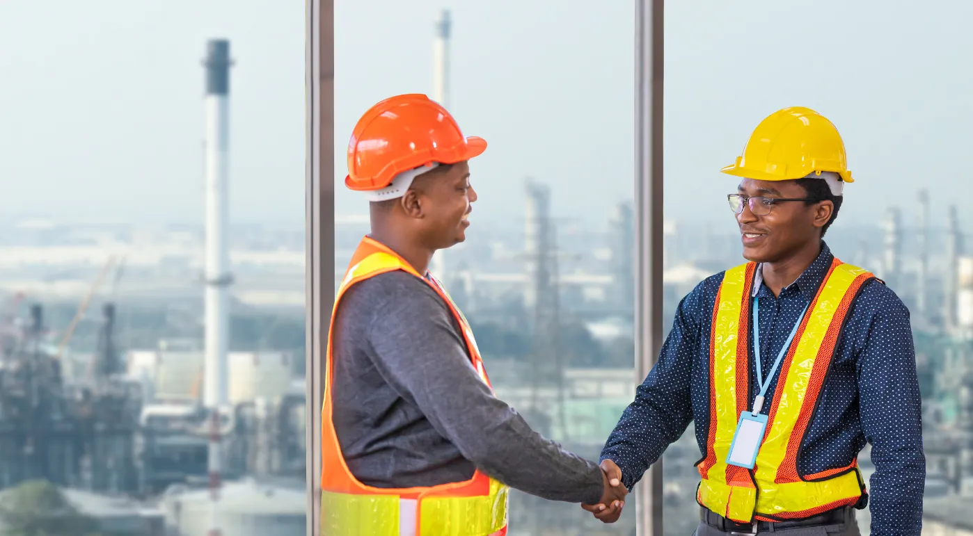 Two workers shaking hands.